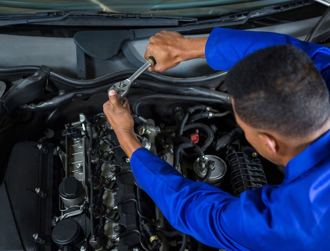Technician working on an engine